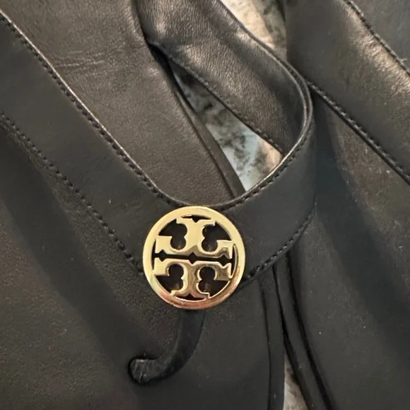 Tory Burch Black Flip Flops with Gold Emblem - Picture 2 of 7